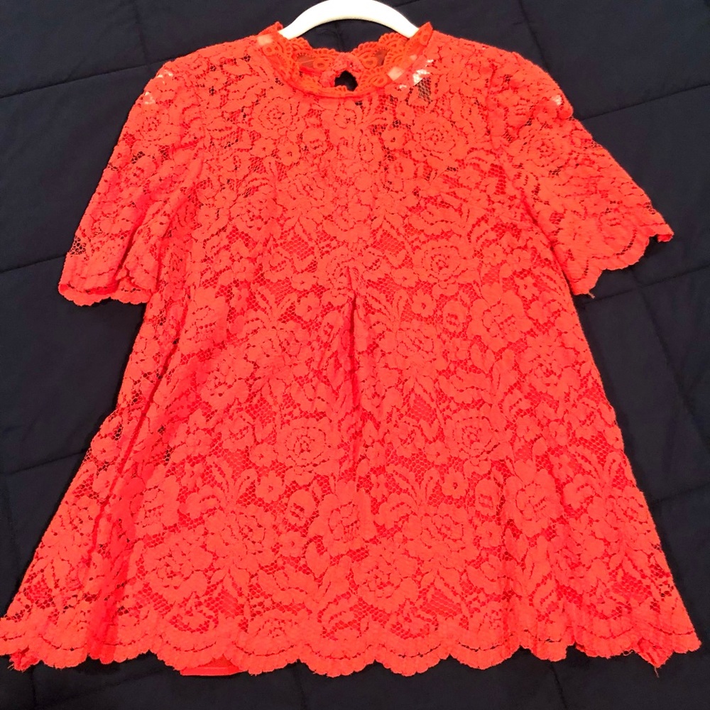 HD in Paris from Anthropologie. Dark orange shirt